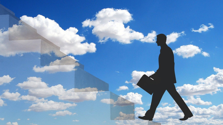 Graphic concept of a man climbing a set of stairs in the sky with a cloud background