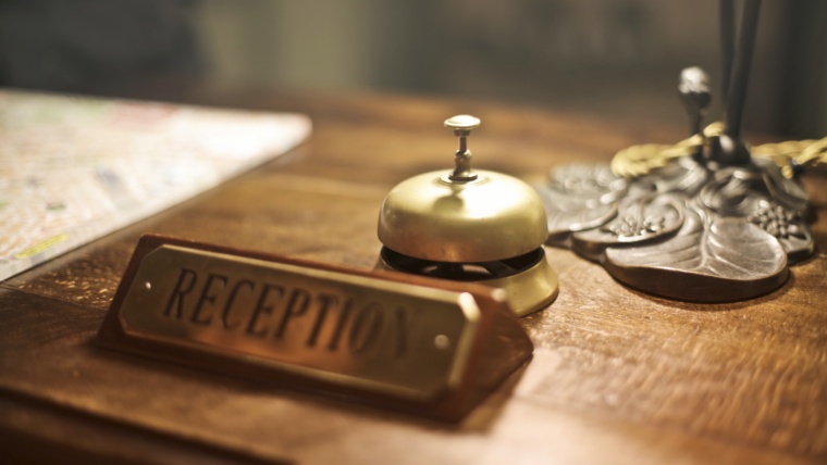 Hotel concierge desk with antique bell
